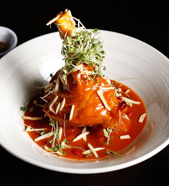 Tandoor flames and glowing embers at Angaara's kitchen